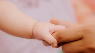 WATCH — Mom Adopts Gas Station Worker's Baby After Learning She Needed Help: 'He's My World'