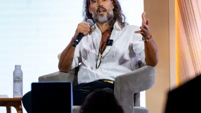 Accused rapist Russell Brand stars in MAHA summit, cracks joke about unwanted touching to Dr. Oz