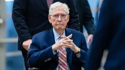 Mitch McConnell swarmed by security as reporter pleads: 'Can you say a word for us?'